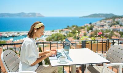 A woman is working whilst on holiday