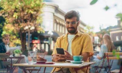 A man uses and app on his phone