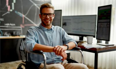 A male wheelchair user in the office