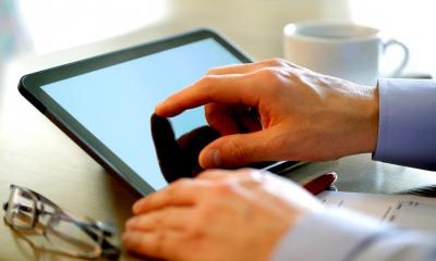 Man using a tablet computer for his business work