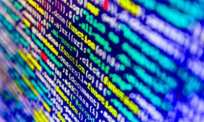 Rows of multicoloured code on computer software screen