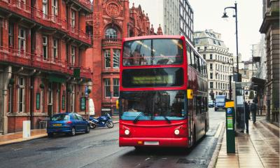 Red double-decker bus at the street of Birmingham, UK