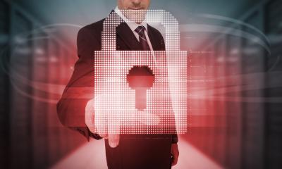 Man in a business suit reaching out for a hologram padlock