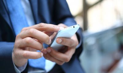 Business man holding smartphone