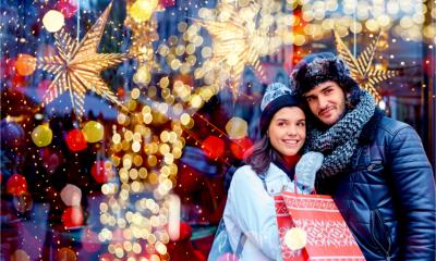 A happy couple buy Christmas gifts from local independent businesses