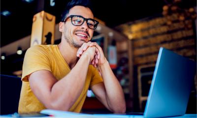 An employee works remotely with his cloud-based telecoms app