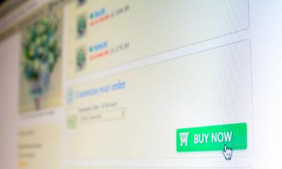 Reluctant customer's cursor hovering over green 'BUY NOW' button