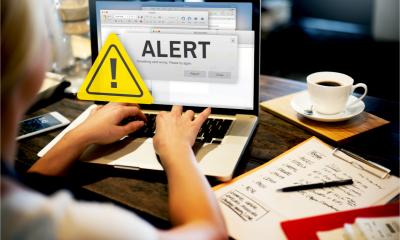 A woman is alerted to a security risk on her business laptop