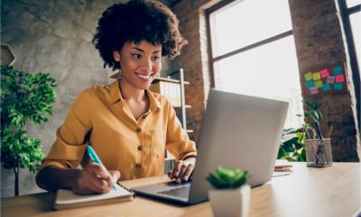 A female freelance is smiling with confidence at her economic outlook