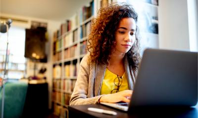 A young woman works on her start up business plan