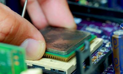 Someone holding a chip In-house vs outsourced IT support