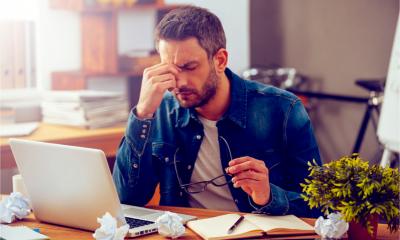 Small A small business owner is feeling stressed after suffering a data breach
