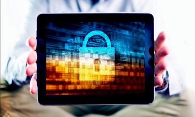 Someone holding a mobile device showing a padlock on the screen