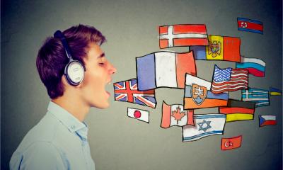 A young man learning multiple foreign languages using an app