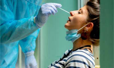 A woman has a COVID test