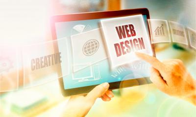 A businesswoman selecting a Web Design business concept on tablet screen.