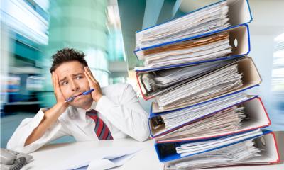 Businessman overwhelmed with the amount of work to be done