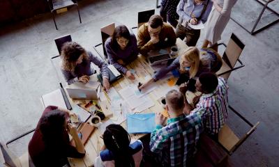 Overhead view of a diverse team working together on a project