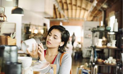 A small businesswoman chooses stock items for her web video