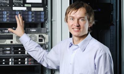 IT manager showing a rack of servers