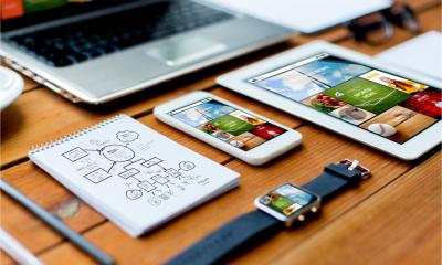 Responsive web design concept - close up of a laptop, tablet pc, notebook and smartphone with the same website