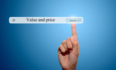 Person pointing to 'Value and price' written into a search bar