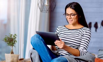 A woman searching for business start up advice on Google