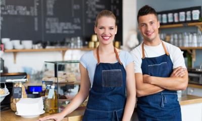 Small business owners in their cafe