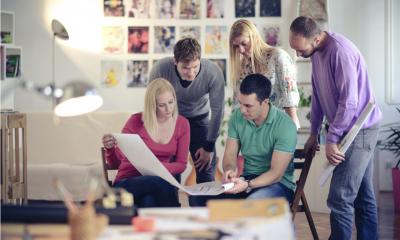 A group of employees discussing a project