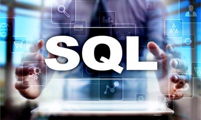 A businessman using tablet pc and selecting sql