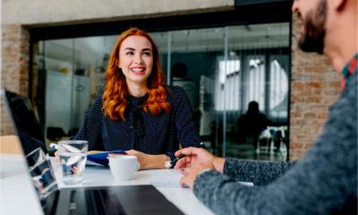 An attractive young woman has her first job interview