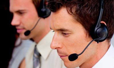 A team use CRM software to answer customer calls